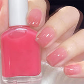 JimysCo COSMOO Nude nail polish bottle close-up with sheer peach-pink shade for natural nails