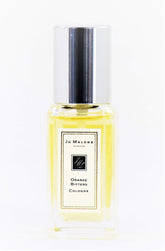 Jo Malone Orange Bitters spray bottle, compact travel size for on-the-go freshness.