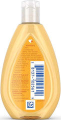 Johnson's Baby Shampoo travel-size bottle pour; mild formula ideal for gentle bath time.