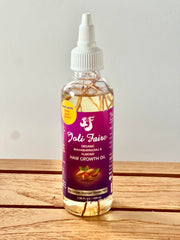 Joli Faire Hair Growth Oil applied to scalp to support thinning areas.