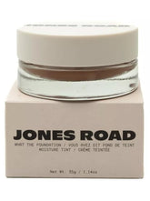 Jones Road What The Foundation beige bottle close-up showing smooth blend for natural-looking skin.