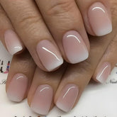 JUGGSSA short square press-on nails in French-ombre for a natural salon look.