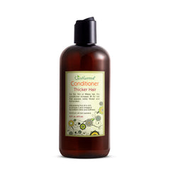 Just Nutritive Thicker Hair Conditioner bottle-pour showing rich, silky texture.