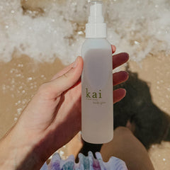 Close-up of Kai Body Glow Rose ingredients with jojoba and chamomile
