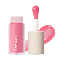Karuna Float tinted lip oil bottle closeup showing hydrating color