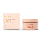 Karuna Lights Out Cream bottle on nightstand promotes overnight hydration and balance.