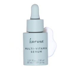 Karuna multi-vitamin day serum bottle delivers lightweight hydration for daily care.
