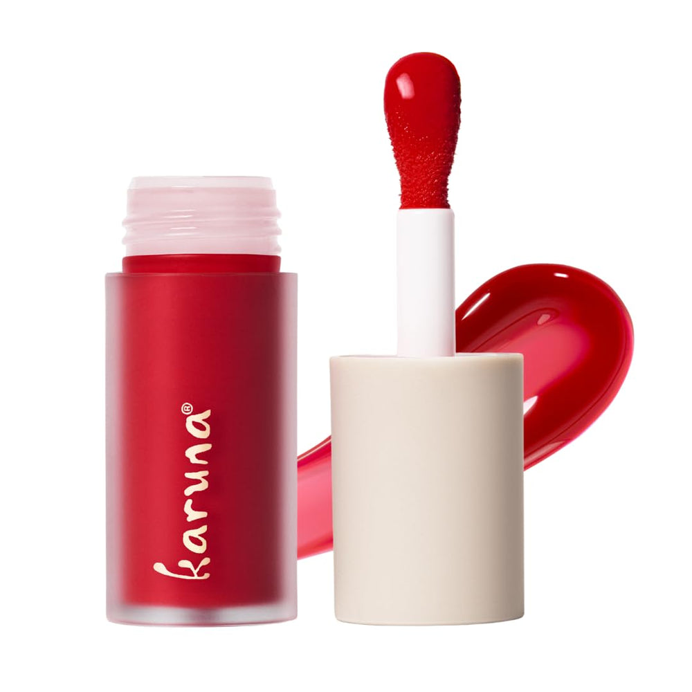 Karuna Skin Tinted Lip Oil Embrace tube close-up; hydrating color with lightweight finish.