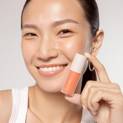 Karuna Lip Oil Pause application swatch shows color with hydration.