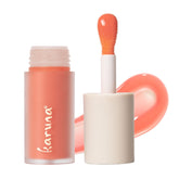Karuna Tinted Lip Oil Pause packaging highlights clean beauty and on-the-go hydration.