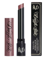 Kat Von D Dazzle Heat Burst swatch on skin shows bold vegan ruby shade for vibrant lids.