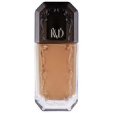Kat Von D Good Apple Tan 074 bottle close-up for shade accuracy and branding