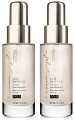 Kenra Platinum Luxe Shine Oil bottle glowing with gold-enriched shine
