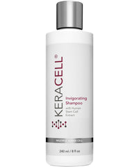 Keracell Invigorating Shampoo bottle pouring for a refreshing scalp cleanse