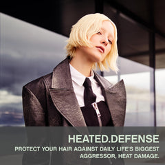 KEVIN.MURPHY Heated.Defense foam texture closeup showing silky smoothing and detangling benefits.