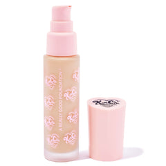Close-up of creamy foundation texture showing blendable formula.