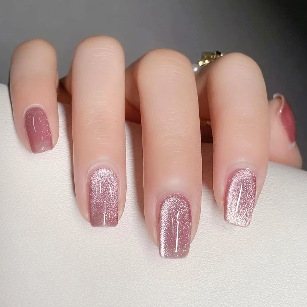 KKUUOO Pink press-on nails with glitter design for a quick, stylish manicure at home.