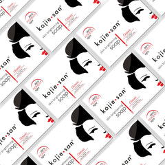 Kojie San soap bar close-up highlights Kojic Acid texture for skin clarity.