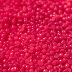 KoluaWax hard wax beads ready for facial waxing with a warm pot.