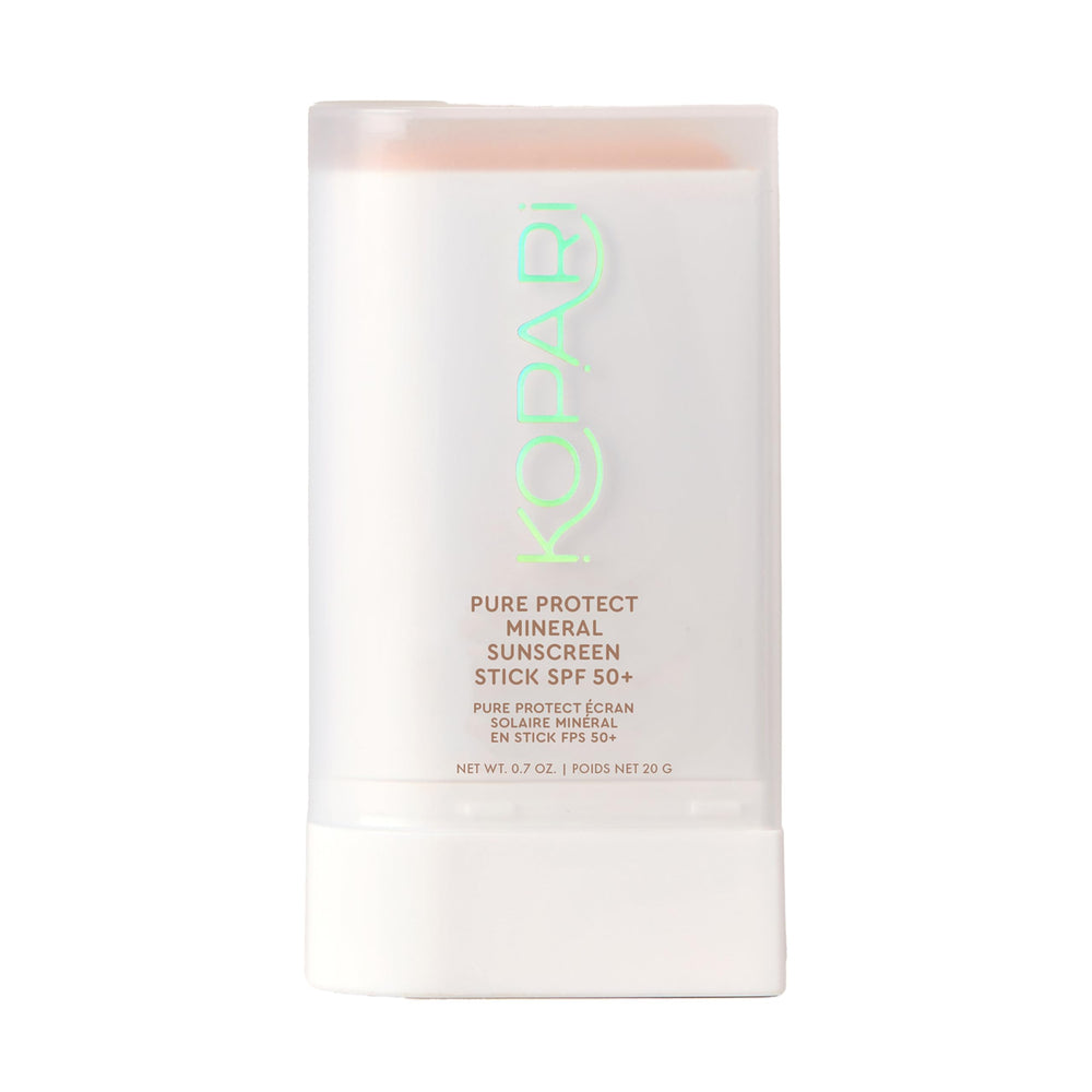 Kopari Pure Protect SPF 50+ stick applying clear sunscreen on face and body for easy protection.