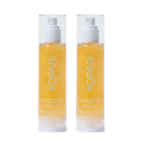 Kopari Sun Shield Body Glow SPF 50 bottle pour delivers quick absorption and radiant protection.