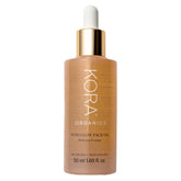 KORA Organics Noni Glow Hydrating Face Oil bottle for nourishing skin.