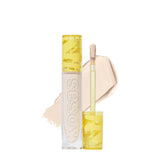 Kosas Revealer Concealer tube close-up showing medium coverage and brightening finish.