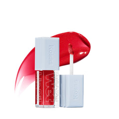 Kosas Wet Lip Oil Gloss bottle-pour showing hydrating shine and plump feel