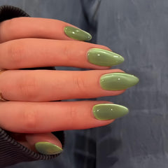 KQueenest Cat Eye Sage Green nails set on hand showing almond shape and style.