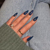 KQueenest Deep Blue press-on nails in glossy almond shape for quick at-home manicure.