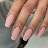 KQueenest light pink press-on nails in medium coffin shape with glossy gel finish