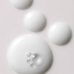 Kristin Ess Anytime Anywhere Scalp Oil application on scalp demonstrating soothing, hydrating action.