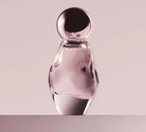 Kylie Cosmetics Cosmic Eau de Parfum bottle close-up highlighting amber floral notes