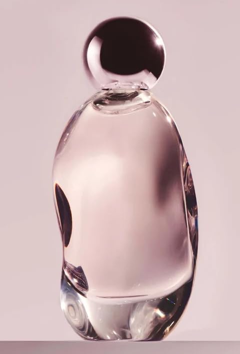 KYLIE COSMETICS Cosmic bottle highlights its sleek ambery floral fragrance for evening wear.