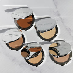 Applying La Bella Donna foundation with brush for buildable coverage