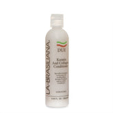 La-Brasiliana Due Keratin and Collagen Conditioner bottle pouring for smoother hair.