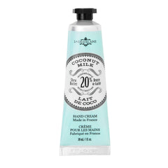 La Chatelaine travel-size hand cream in coconut milk tube for on-the-go hydration.