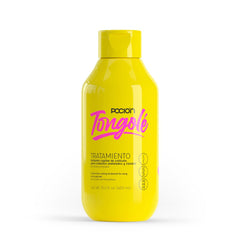 La Pocion Tongolé Leave-In Conditioner spray applying lasting moisture.