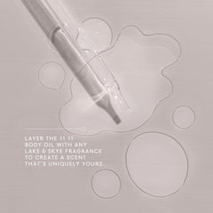 Lake & Skye 11 11 Body Oil Mini dropper in use for massaging into the skin