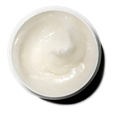 Jar being applied as creamy body moisturizer