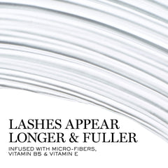 Close-up of curved wand lifting lashes for an open-eye look.