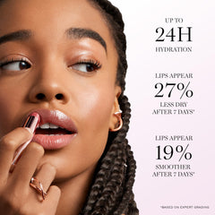 Lancôme Lip Idôle Butterglow applying swatch on lips for color build.