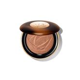 Lancôme Teint Idole C.E. highlighter bottle closeup for long-lasting luminous glow.