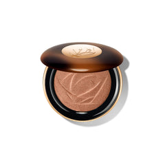 Lancôme Teint Idole C.E. highlighter bottle closeup for long-lasting luminous glow.