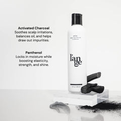 L'ANGE HAIR Detox Charcoal Conditioner bottle pour showing easy even coverage.