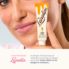 Applying Lanolips 101 Ointment on lips for smooth results.
