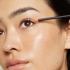 LashFood serum drops on lash line demonstrating easy nightly use