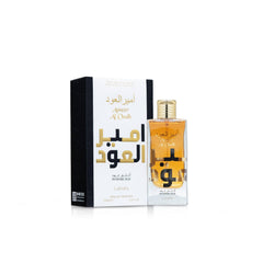 Lattafa Ameer Al Oud Intense bottle side angle, rich amber depth visible.