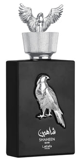 Lattafa Shaheen Silver bottle pour highlights a bright citrus opening for daily wear.