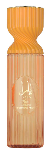 Lattafa Yara Tous perfume mist bottle shows tropical fruit notes for everyday freshness.
